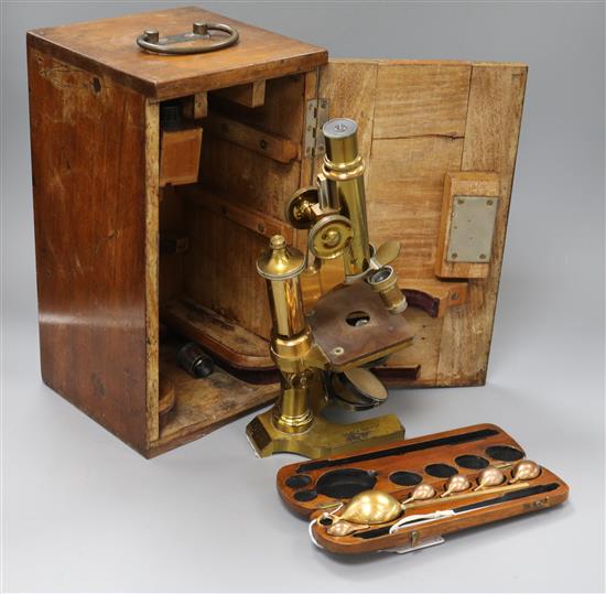 A mahogany cased brass microscope and a Negretti & Zambra hygrometer